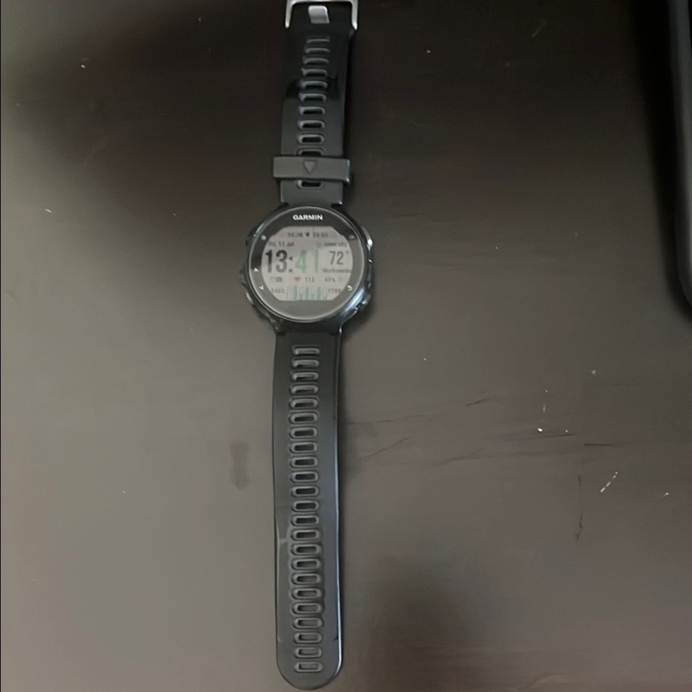 Garmin Black Smartwatch with Circular Display and Silicone Strap